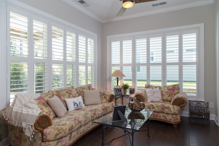 Sunroom with faux wood shutters in Sacramento.